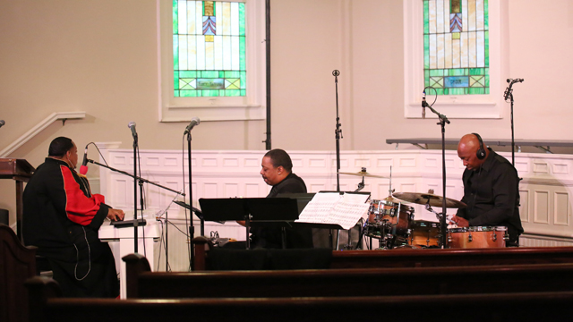 Musicians preparing to perform. Image taken by Mia Beach.